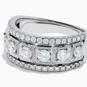 The Classique 14K White Gold Diamond Ring features large round diamonds in square frames, bordered by rows of smaller diamonds, all beautifully crafted in shining 14K white gold.
