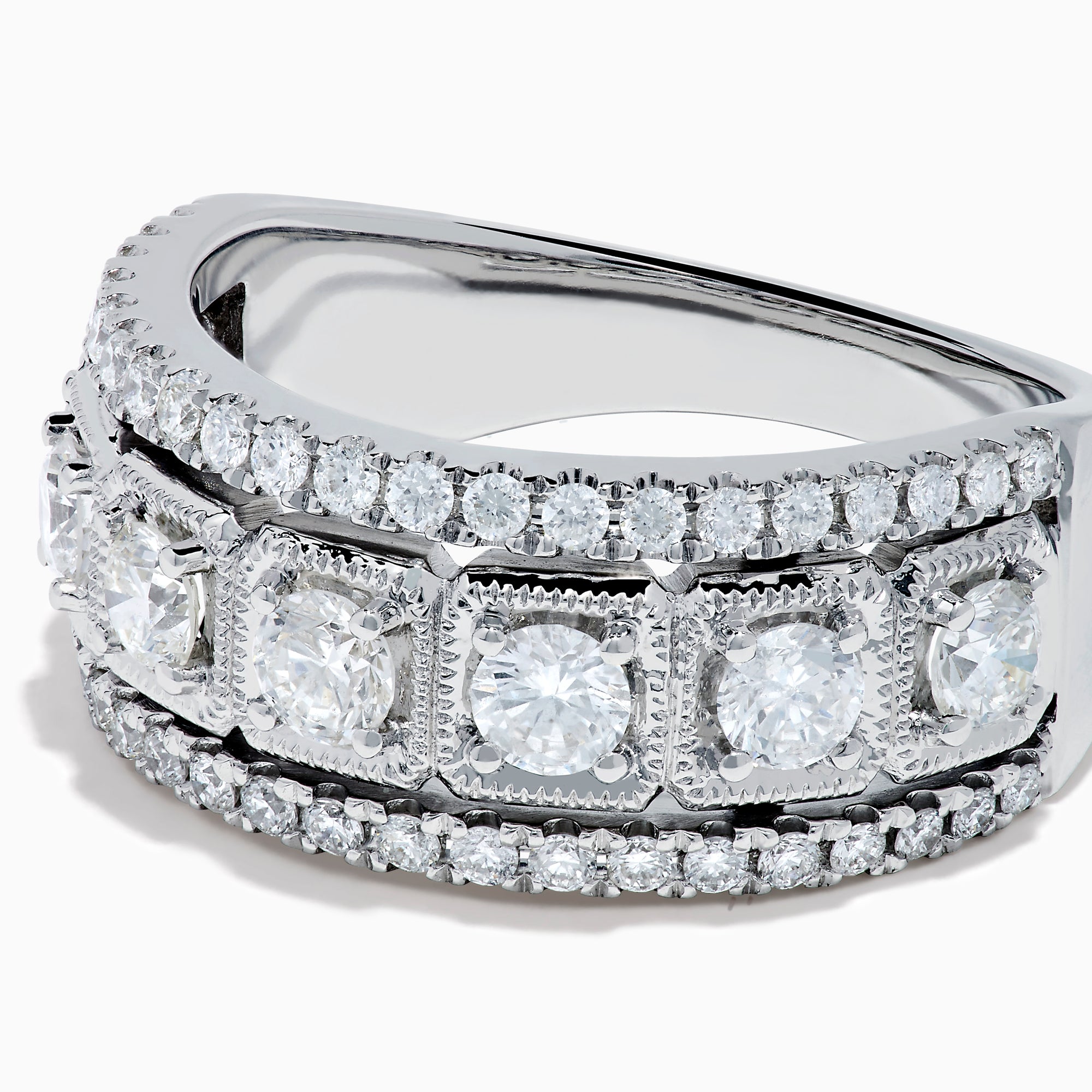 The Classique 14K White Gold Diamond Ring features large round diamonds in square frames, bordered by rows of smaller diamonds, all beautifully crafted in shining 14K white gold.