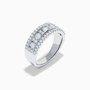 The 14K White Gold Channel Set Diamond Wide Band Ring features three rows of round diamonds, with five larger channel-set stones in the center and smaller diamonds on either side, creating an elegant, eye-catching look.