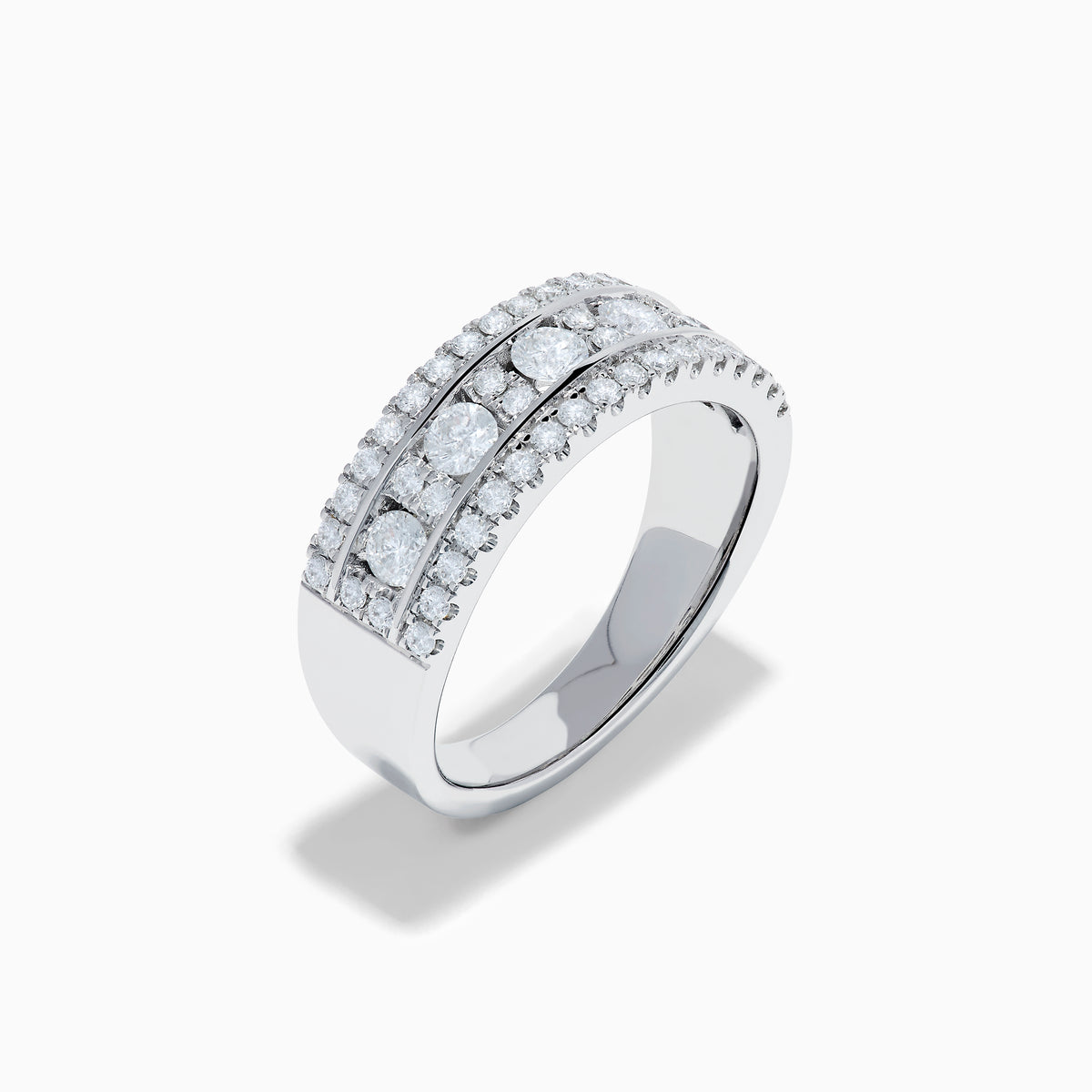 The 14K White Gold Channel Set Diamond Wide Band Ring features three rows of round diamonds, with five larger channel-set stones in the center and smaller diamonds on either side, creating an elegant, eye-catching look.