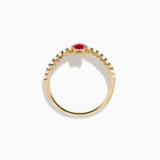 The 14K Yellow Gold Ruby Heart and Diamond Contoured Ring features a V-shaped band set with white diamonds and a vivid ruby heart at its center.