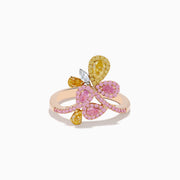 The Trio 18K Three Tone Gold Multi Color Diamond Bouquet Ring showcases overlapping loops with pink, yellow, and white diamonds in a delicate floral-inspired bouquet design.