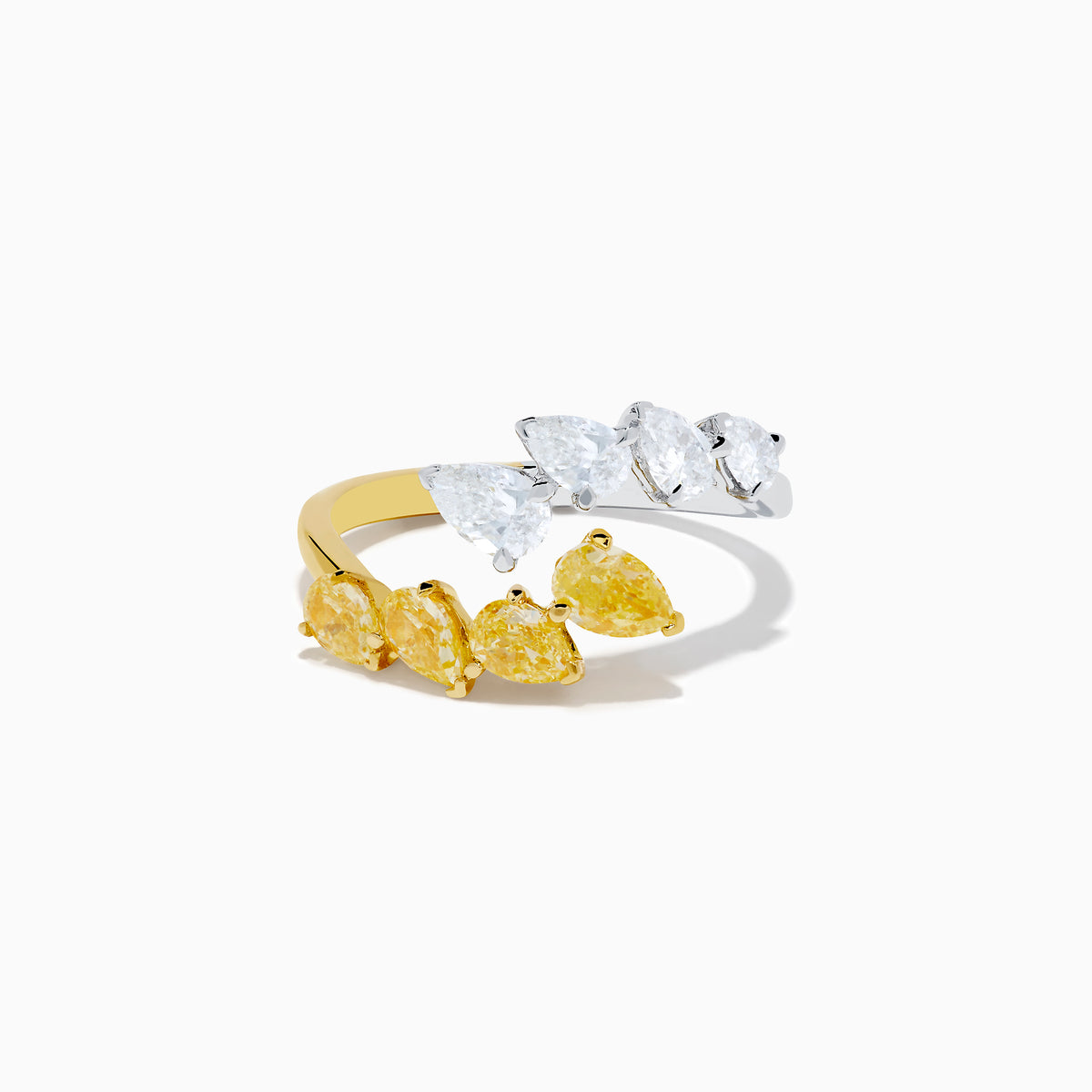 The Canare 18K Two Tone Gold White & Yellow Diamond Bypass Ring showcases three yellow pear-shaped diamonds on one side and three white pears on the other, displayed against a simple white background.