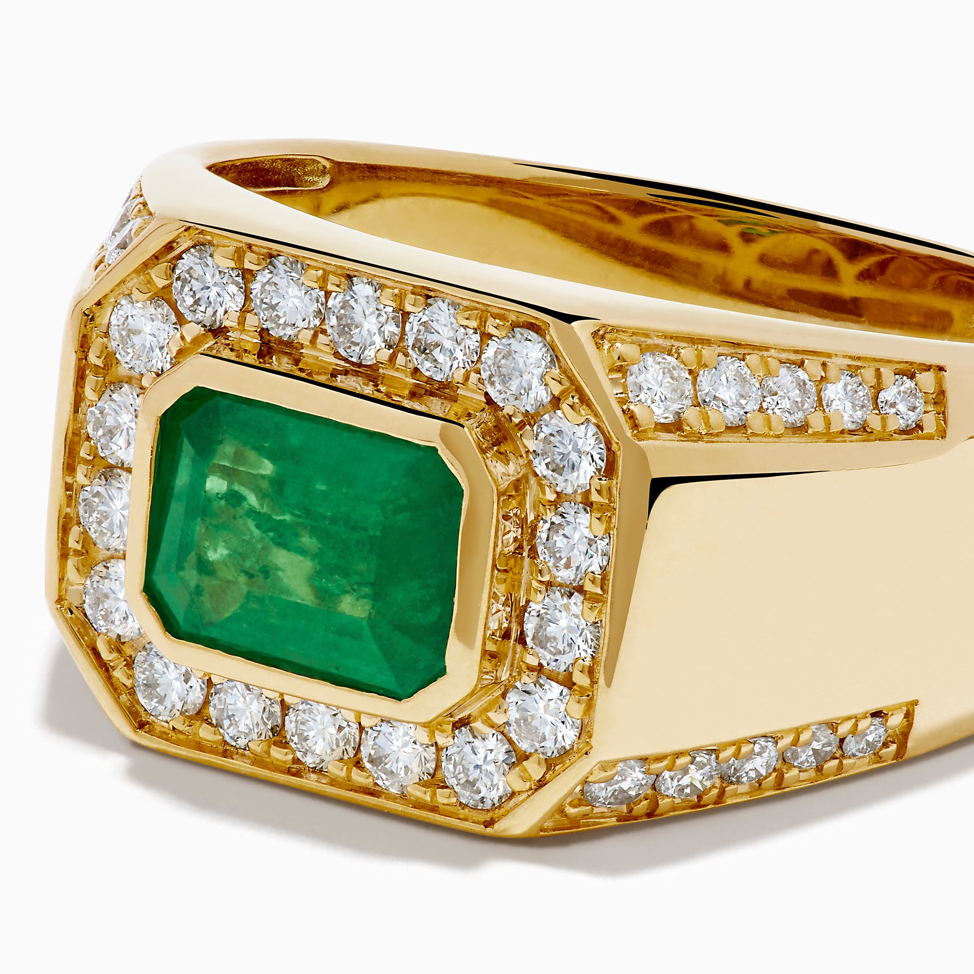 The Men's 14K Yellow Gold Emerald Signet Ring features a rectangular green emerald center, double diamond halo, and side diamonds along the band.