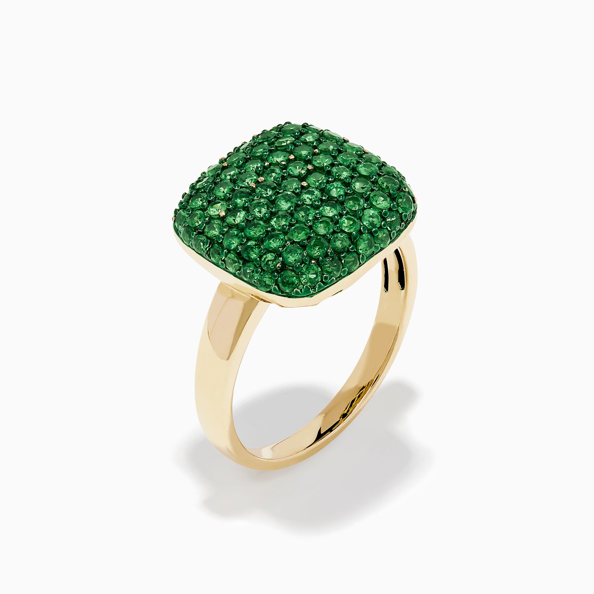 A 14K Yellow Gold Tsavorite Pave Ring with Green Rhodium, featuring a cushion-shaped top set with numerous small green gemstones, is displayed against a white background.