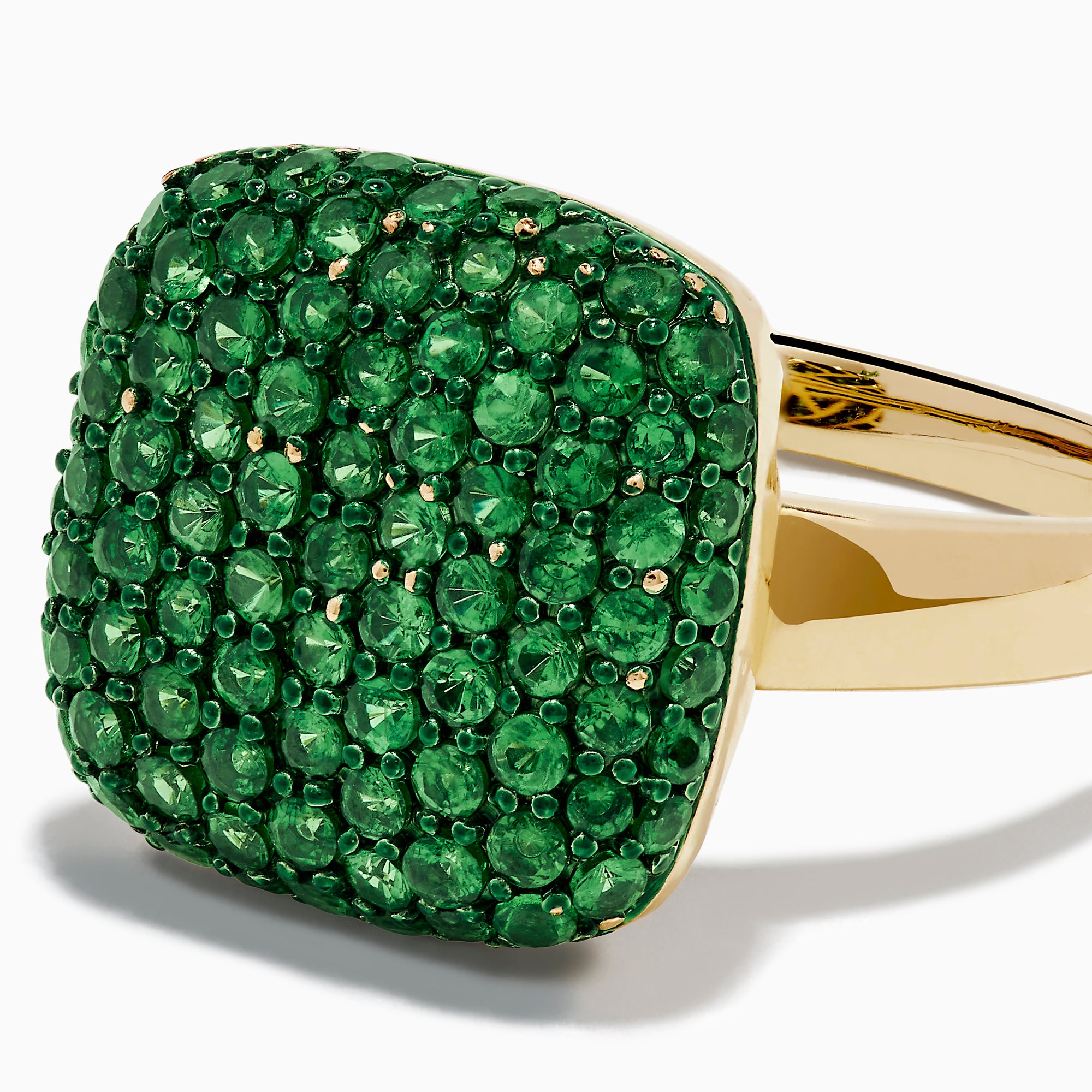 A 14K Yellow Gold Tsavorite Pave Ring with Green Rhodium, featuring a cushion-shaped top set with numerous small green gemstones, is displayed against a white background.