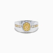 The Men's 18K Two Tone Gold Yellow and White Diamond Signet Ring showcases an oval yellow gemstone at the center, framed by a halo of clear diamonds, with rows of yellow stones along each side of the band.