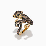 The Espresso 14K Yellow Gold and Black Diamond Monkey Ring features a whimsical monkey with exaggerated eyes and ears, encrusted with brown and black diamonds as it sits clutching its tail—an eye-catching statement piece.