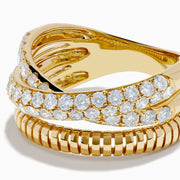 A stack of three 14K Yellow Gold Diamond Pave Crossover Rings, featuring two with diamond pave and wavy crossover design, and one with a grooved, ridged texture, displayed against a white background.