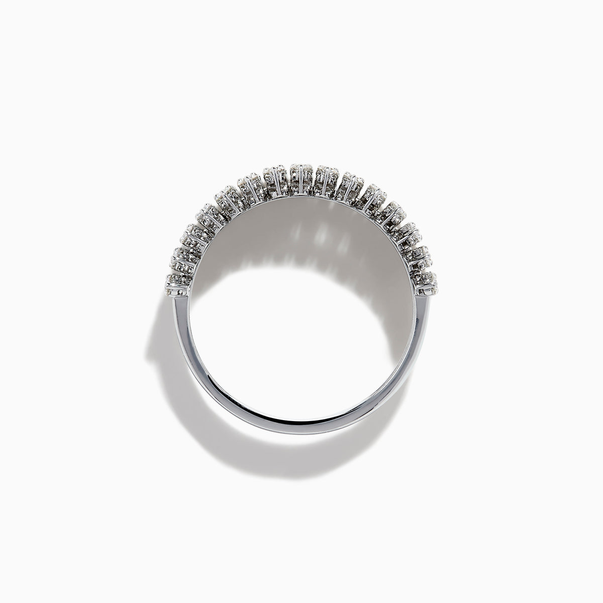 The 14K White Gold Baguette and Round Diamond Statement Ring features multiple rows of sparkling diamonds in a symmetrical, luxurious design, displayed elegantly against a white background.