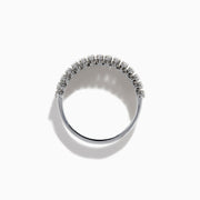 The 14K White Gold Baguette and Round Diamond Statement Ring features multiple rows of sparkling diamonds in a symmetrical, luxurious design, displayed elegantly against a white background.