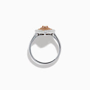 The 18K Two Tone Pear Shape Pink and White Diamond Halo Ring showcases a pear-shaped center, double halos of pink and white diamonds, and a slim two-tone band, set against a white background.
