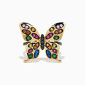 The Watercolors 14K Yellow Gold Multi Sapphire and Black Diamond Butterfly Ring features vibrant sapphires in pink, orange, green, blue, and purple—an eye-catching accessory for any occasion.
