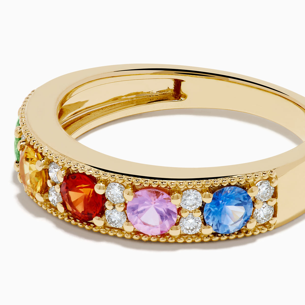 The Watercolors 14K Yellow Gold Multi Sapphire and Diamond Band features green, yellow, red, pink, and blue sapphires with sparkling white diamonds along the band, shown against a white background.
