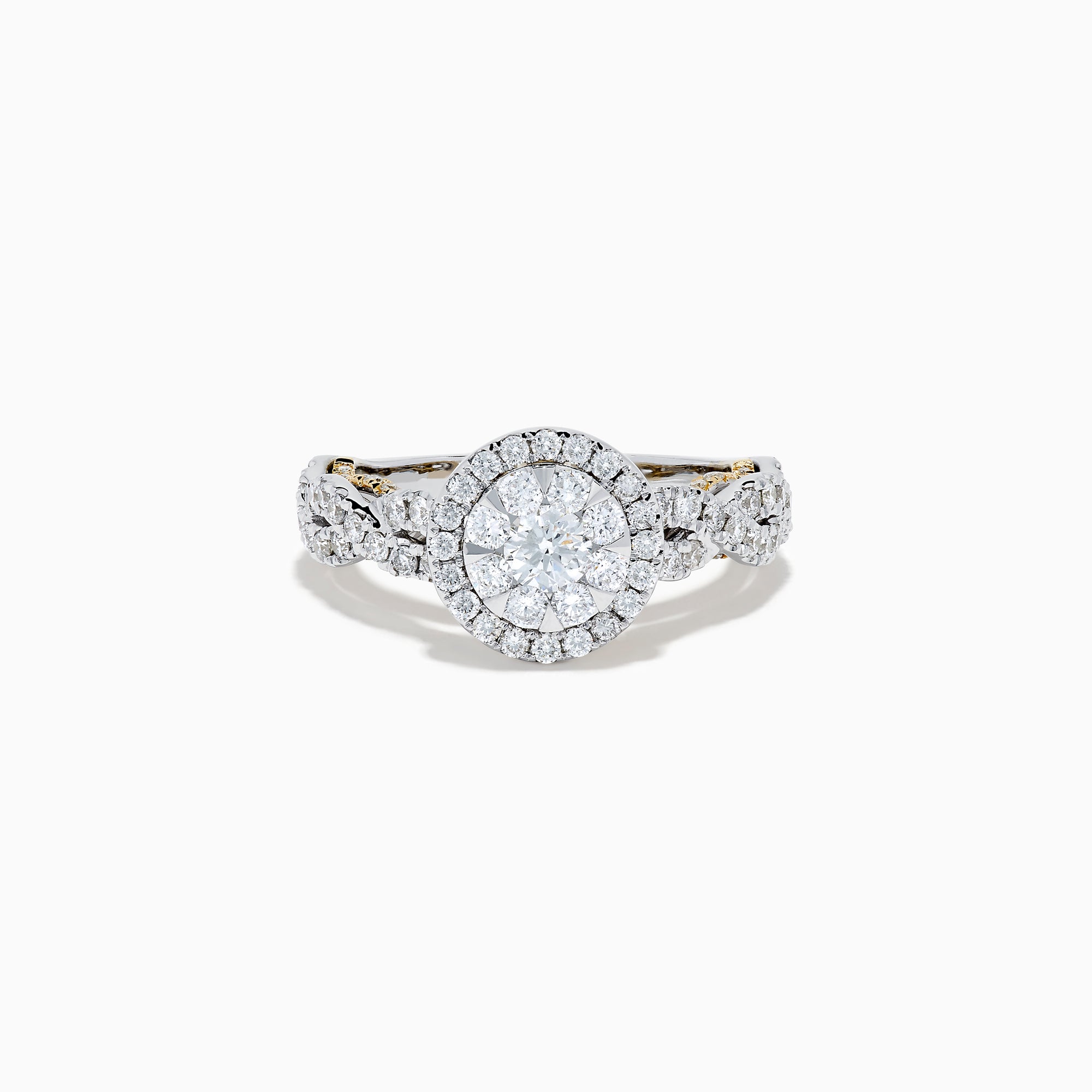 The 14K Two Tone Gold Diamond Cluster Engagement Ring features a central round diamond cluster, surrounded by a halo of smaller diamonds on an intricately designed band embellished with more diamonds.