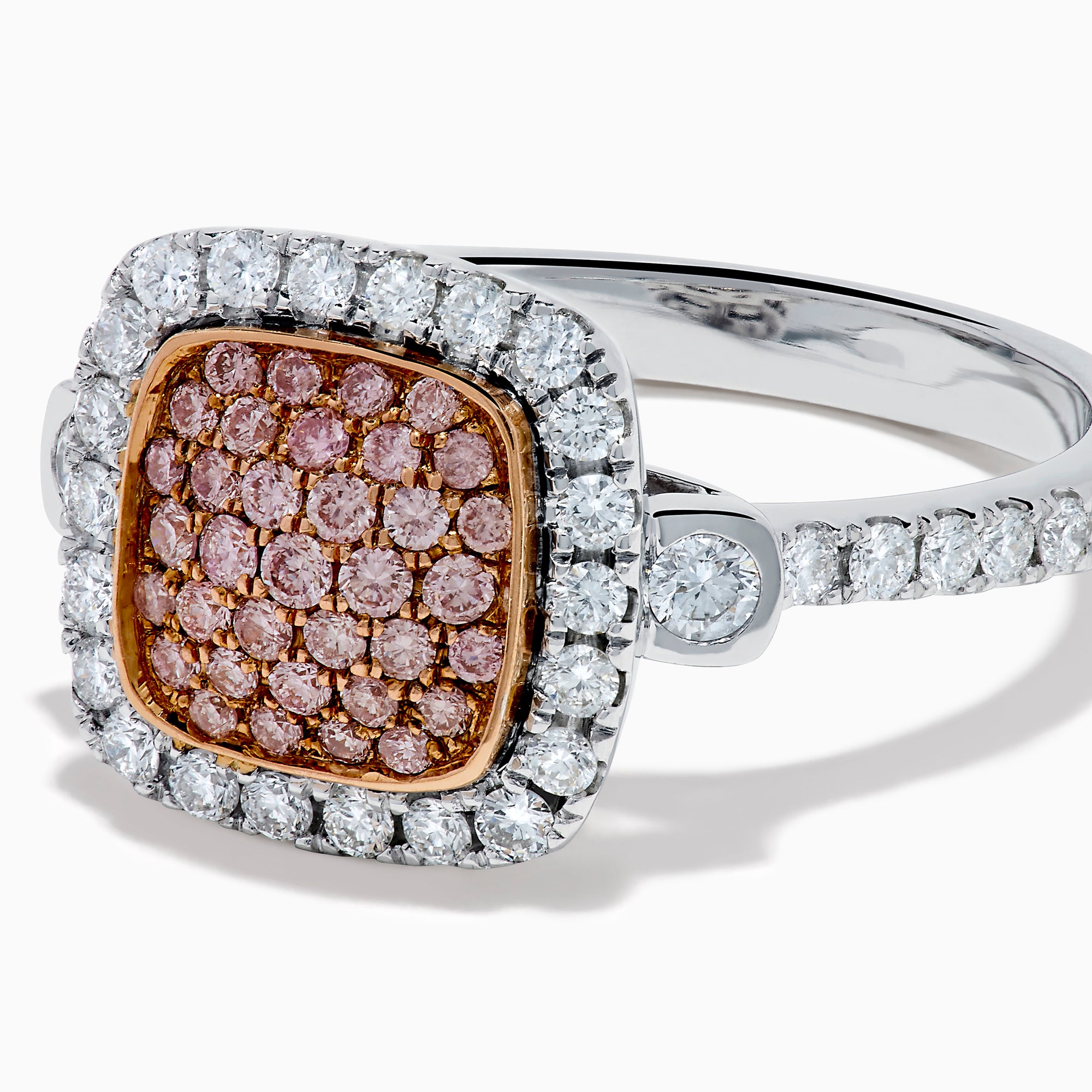The 14K Two Tone Gold Pave Pink and White Diamond Halo Ring features a square center cluster of pink stones, bordered by white diamonds on a two-tone gold band, displayed against a white background.