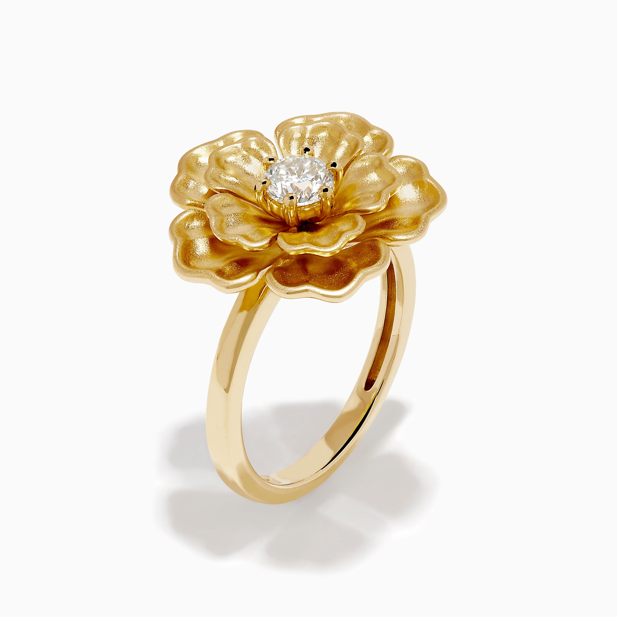 The 14K Yellow Gold Diamond Sculpted Flower Ring features five textured petals and a sparkling round diamond at the center, displayed on a white background.
