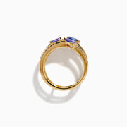 The 14K Yellow Gold Tanzanite and Diamond Multi-Row Statement Ring features three stacked bands set with white diamonds and pear, oval, and cushion-cut blue tanzanite gemstones.
