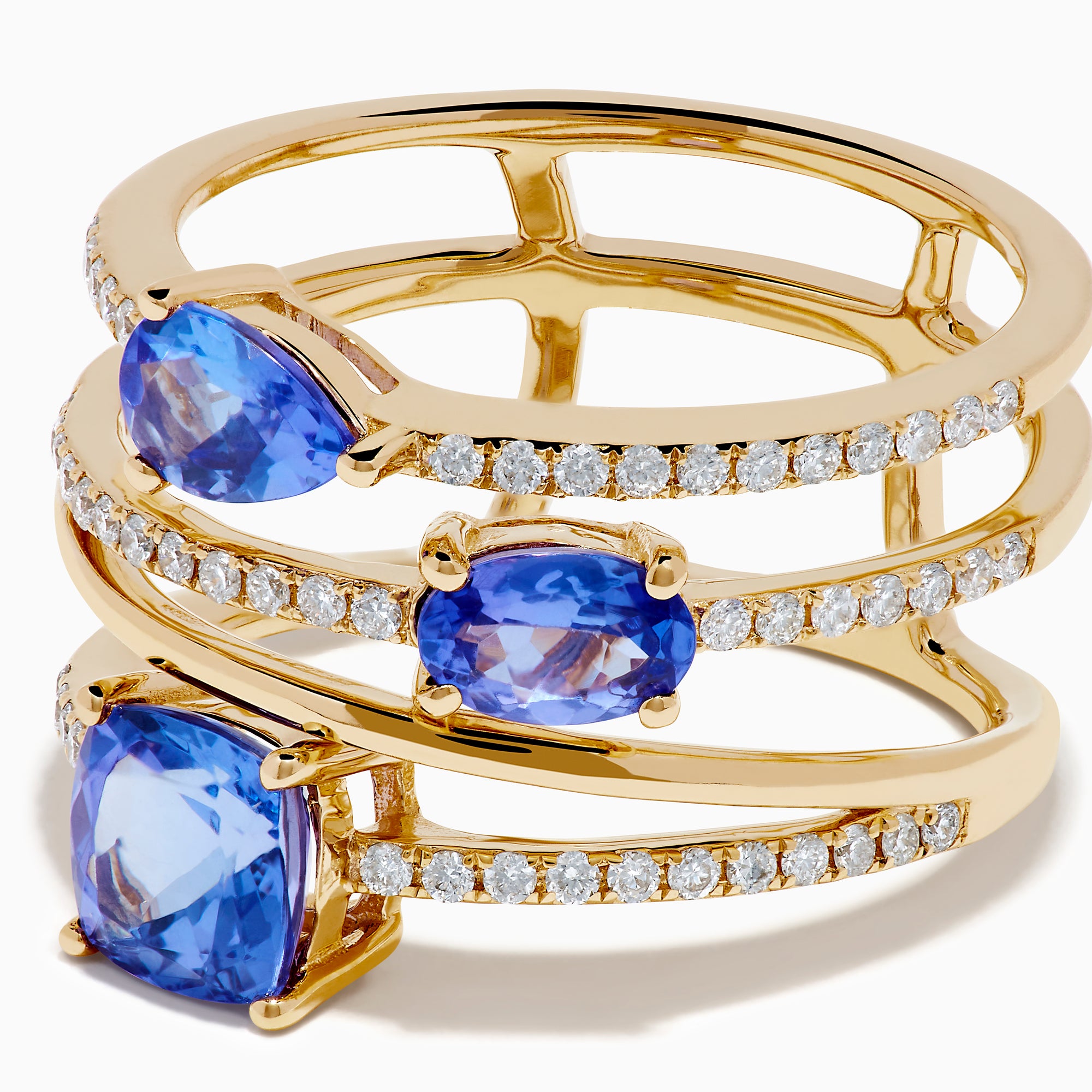 The 14K Yellow Gold Tanzanite and Diamond Multi-Row Statement Ring features three stacked bands set with white diamonds and pear, oval, and cushion-cut blue tanzanite gemstones.