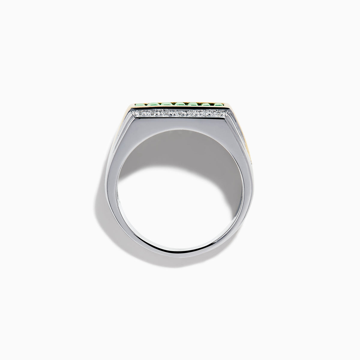 The Men's Two Tone Gold Channel Set Emerald and Diamond Signet Ring showcases a row of square-cut emeralds bordered by rows of round diamonds, blending elegance and bold style.