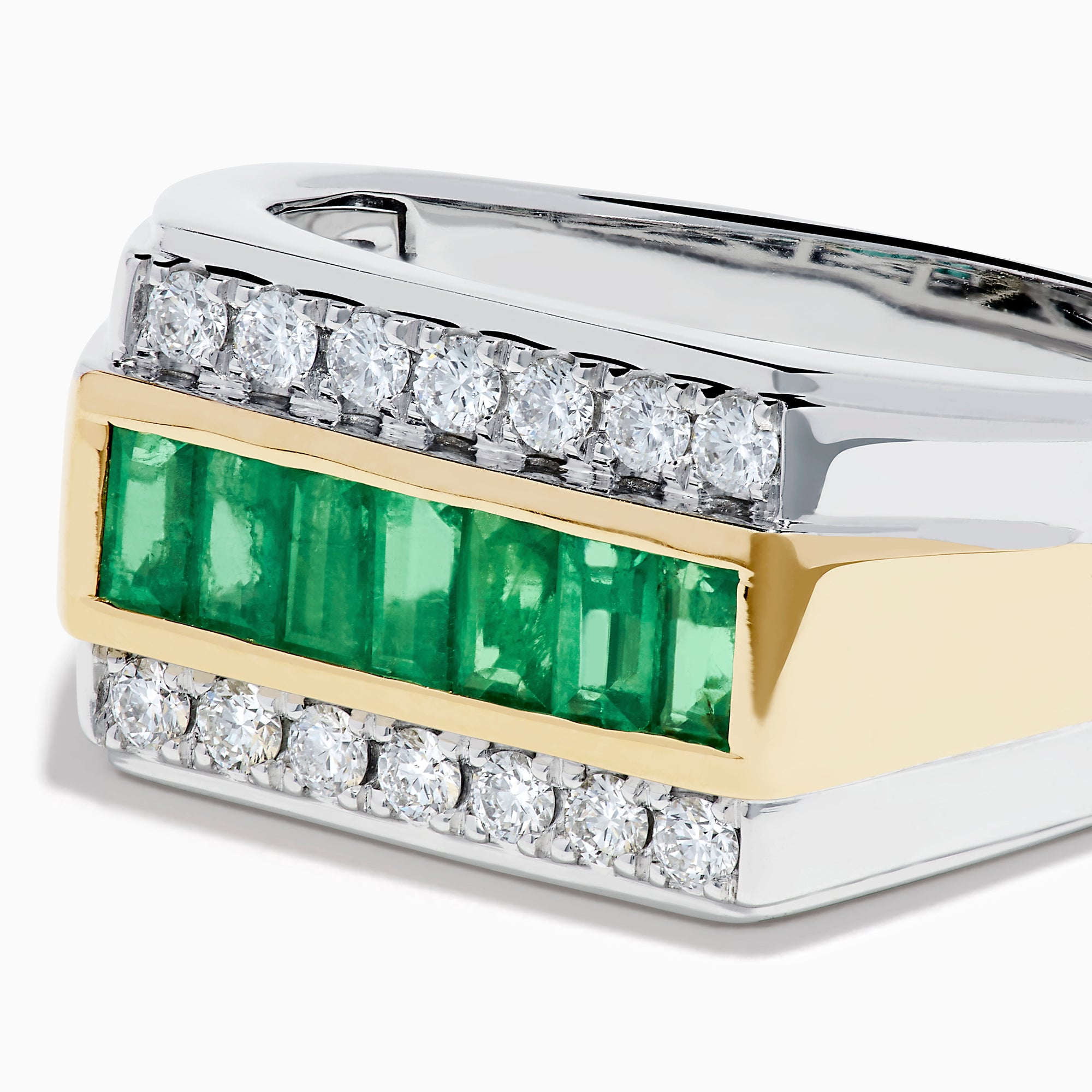 The Men's Two Tone Gold Channel Set Emerald and Diamond Signet Ring showcases a row of square-cut emeralds bordered by rows of round diamonds, blending elegance and bold style.