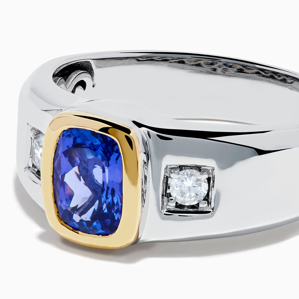 Men's 14K two tone gold ring featuring a cushion cut tanzanite center in a gold bezel setting, flanked by two square diamonds, shown on a plain white background.