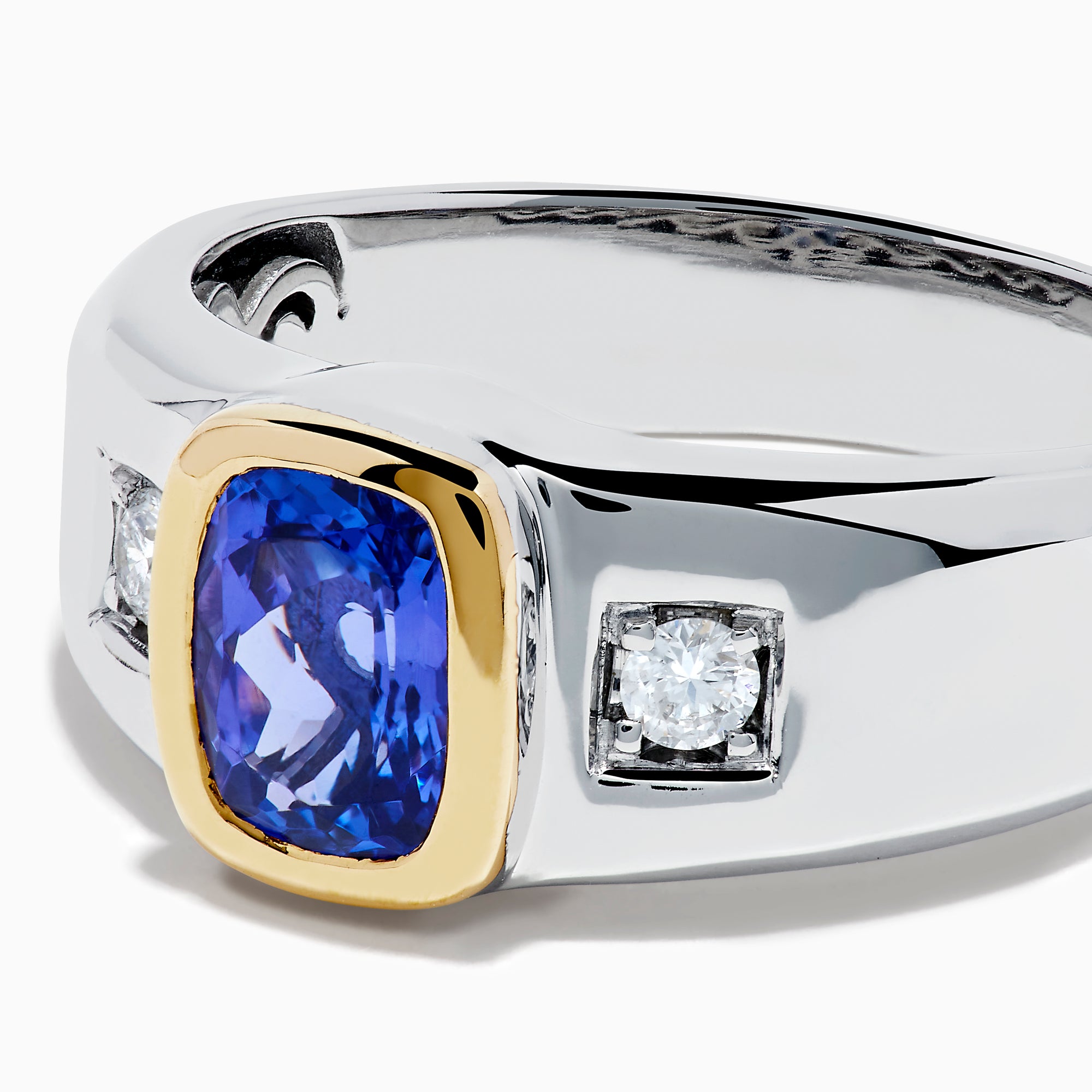 Men's 14K two tone gold ring featuring a cushion cut tanzanite center in a gold bezel setting, flanked by two square diamonds, shown on a plain white background.