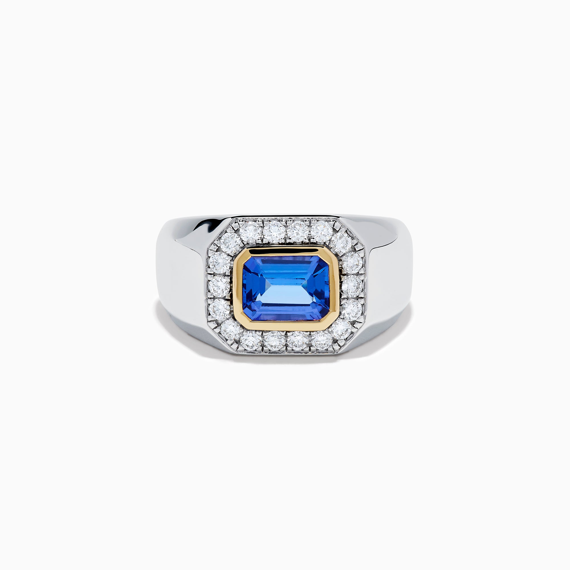 The Men's 14K Two Tone Gold East West Emerald Cut Tanzanite and Diamond Ring features a rectangular blue tanzanite set in a gold bezel, framed by white diamonds, all beautifully crafted against a plain white background.