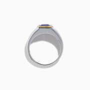 The Men's 14K Two Tone Gold Bezel Set Tanzanite and Diamond Signet Ring features a bold square tanzanite center, bordered by a gold bezel, and accented with small round diamonds on each side of the band.