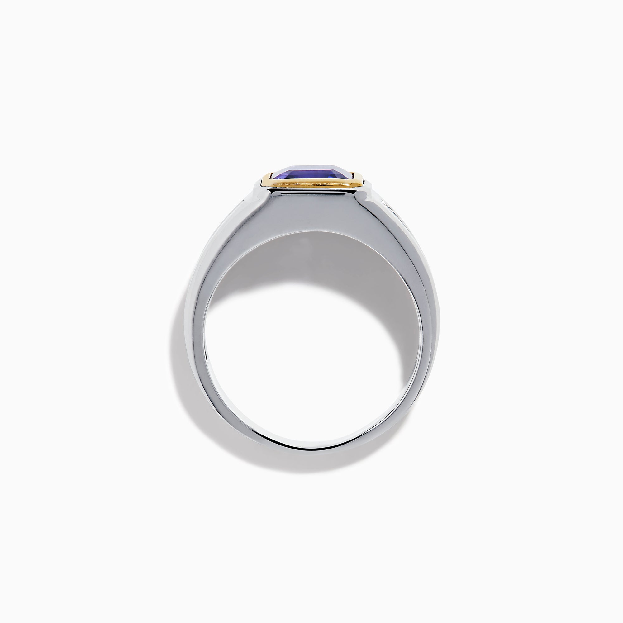 The Men's 14K Two Tone Gold Bezel Set Tanzanite and Diamond Signet Ring features a bold square tanzanite center, bordered by a gold bezel, and accented with small round diamonds on each side of the band.