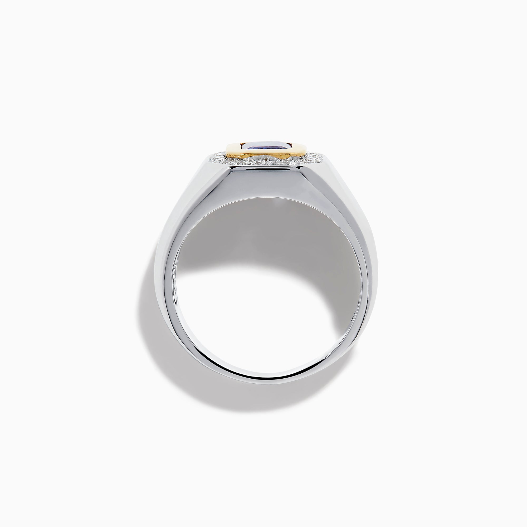 The Men's 14K Two Tone Gold Tanzanite and Diamond Bezel Halo Ring features a rectangular blue tanzanite framed by dazzling white diamonds, set on a bold band for a standout look.