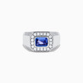 The Men's 14K White Gold East West Tanzanite and Diamond Signet Ring features a rectangular tanzanite center set among round diamonds in a bold geometric design, showcased on a white background.