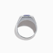 The Men's 14K White Gold East West Tanzanite and Diamond Signet Ring features a rectangular tanzanite center set among round diamonds in a bold geometric design, showcased on a white background.