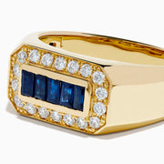 The Men's 14K Yellow Gold Diamond and Blue Sapphire Signet Ring features a bold rectangular center of blue sapphires, framed by round white diamonds in a symmetrical yellow gold setting.