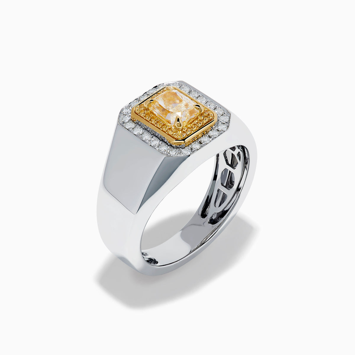 The Men's 18K Two Tone Yellow and White Diamond Ring features a rectangular yellow gemstone at its center, surrounded by double halos of white stones and yellow-gold details, shown on a white background.