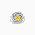 The 14K Two Tone Yellow Gold Yellow and White Diamond Halo Spiral Ring features a central square yellow gemstone, surrounded by a diamond halo with two rows of white diamonds in a sparkling circular spiral design.