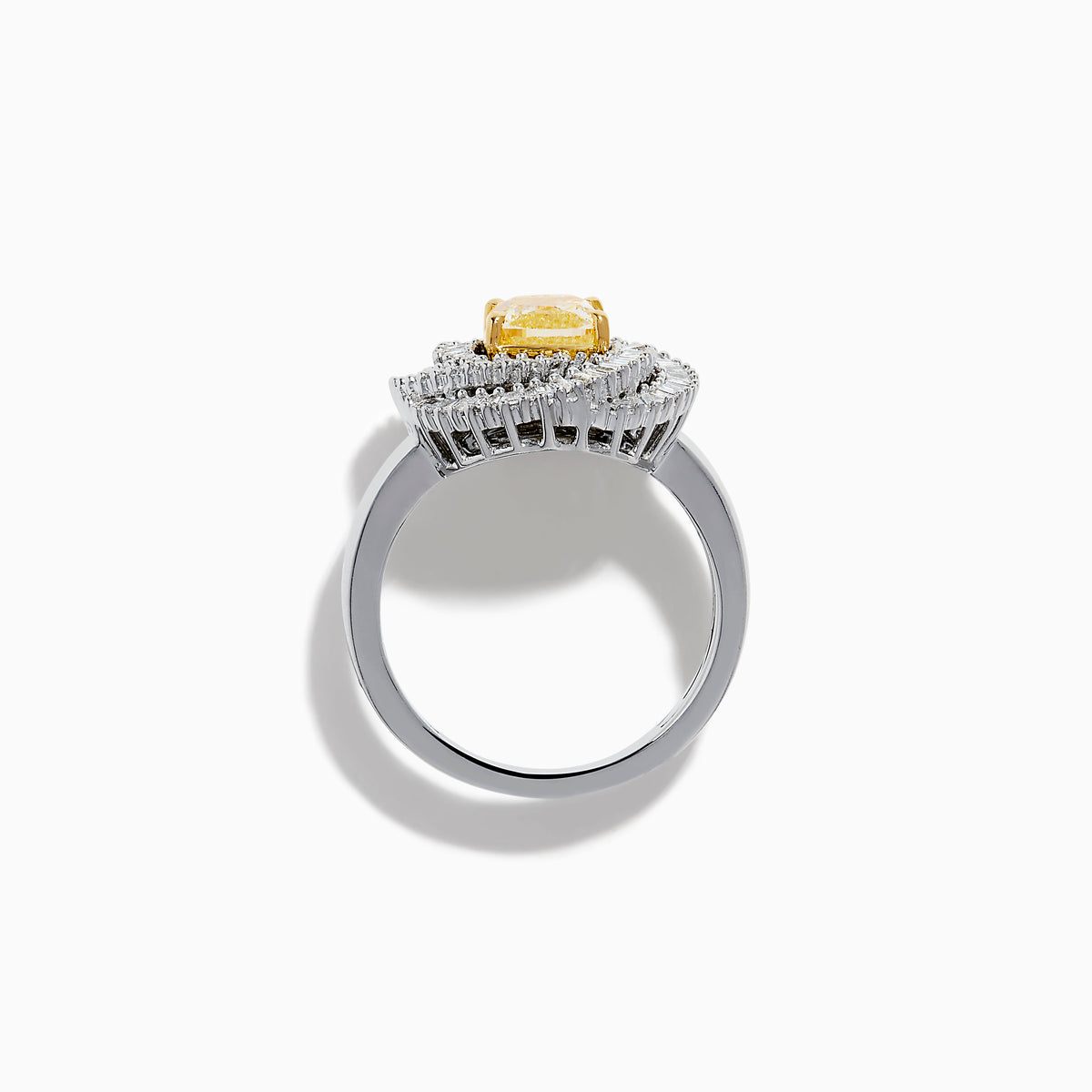 The 14K Two Tone Yellow Gold Yellow and White Diamond Halo Spiral Ring features a central square yellow gemstone, surrounded by a diamond halo with two rows of white diamonds in a sparkling circular spiral design.