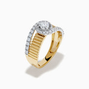 The 14K Two-Tone Diamond Fluted Bypass Ring features a ribbed band with a central round diamond, partly wrapped by a curved row of smaller diamonds.