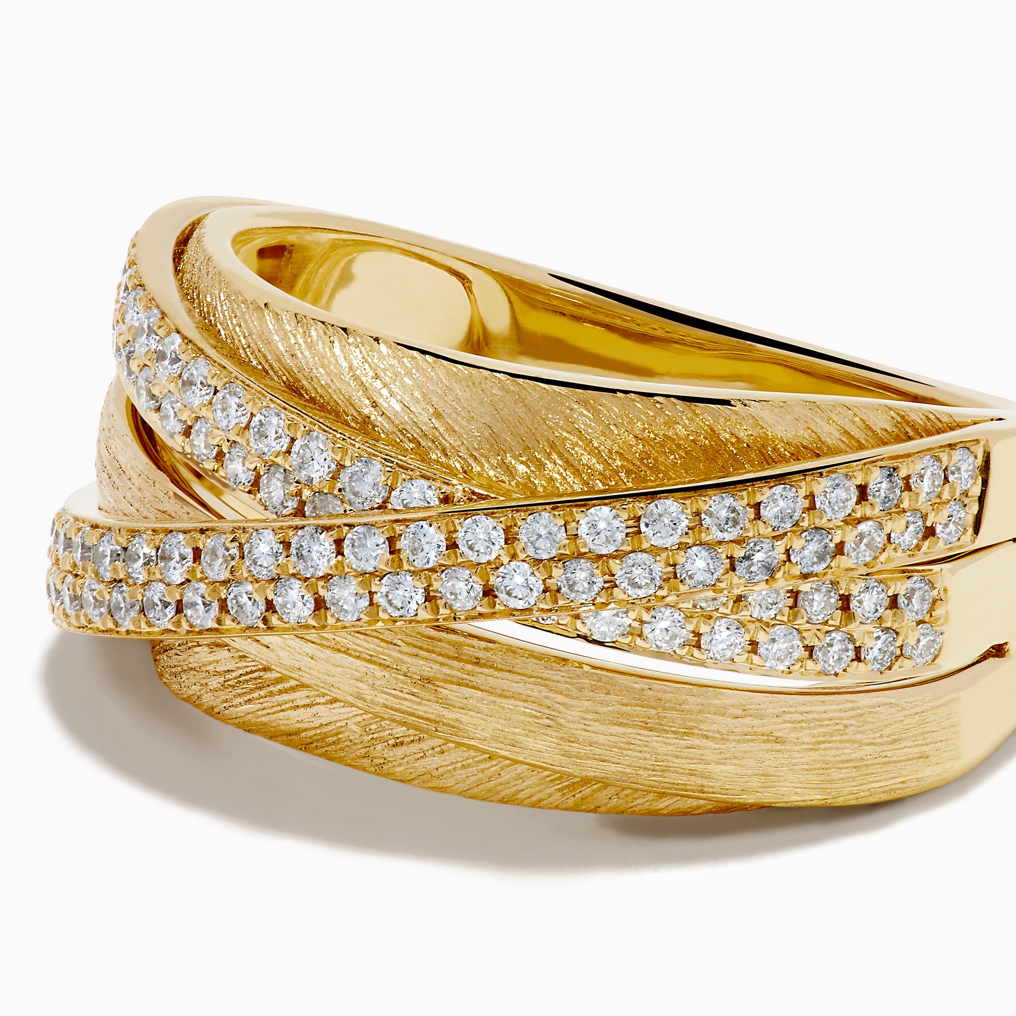 The 14K Yellow Gold Textured Diamond Crossover Ring features overlapping bands—two set with sparkling diamonds and others with brushed texture—for a bold contrast of shine and matte elegance.