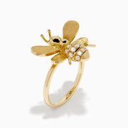 The 14K Yellow Gold Diamond Honeybee Ring features a bee design with textured wings and a striped body accented by sparkling diamonds.