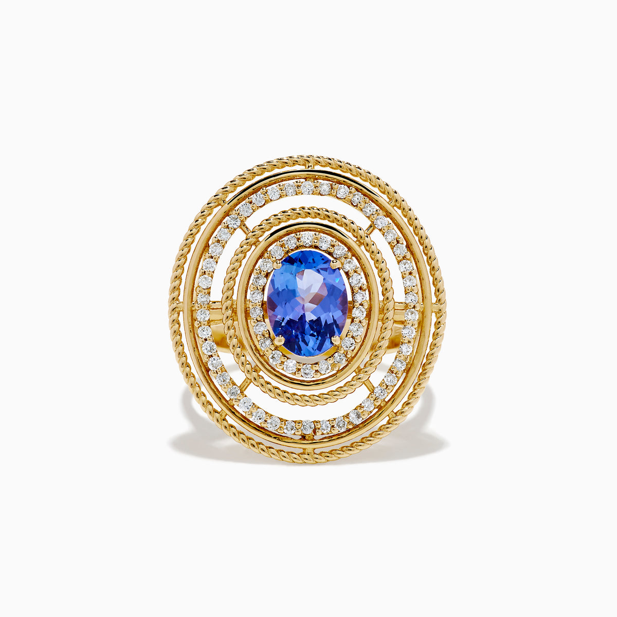 The 14K Yellow Gold Tanzanite and Diamond Concentric Halo Ring showcases concentric circular diamond bands with a central oval tanzanite gemstone, elegantly presented on a white background.