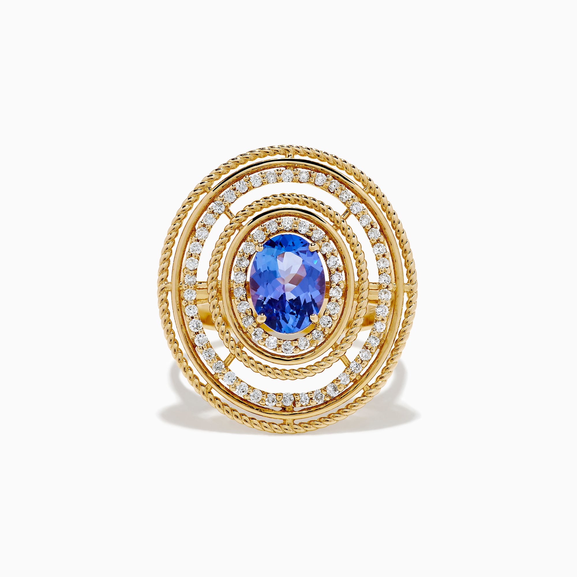The 14K Yellow Gold Tanzanite and Diamond Concentric Halo Ring showcases concentric circular diamond bands with a central oval tanzanite gemstone, elegantly presented on a white background.