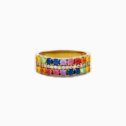 The 925 Sterling Silver with Yellow Gold Plating Cabochon Multi Sapphire Ring showcases three rows: two outer rows of multicolored sapphires and a middle row of small clear stones set on a wide yellow gold-plated band.