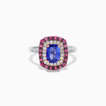 The 14K Two Tone Gold Tanzanite, Diamond, and Pink Sapphire Cushion Halo Ring features a striking tanzanite center, framed by sparkling diamonds and a halo of vivid pink sapphires on a sleek white background.