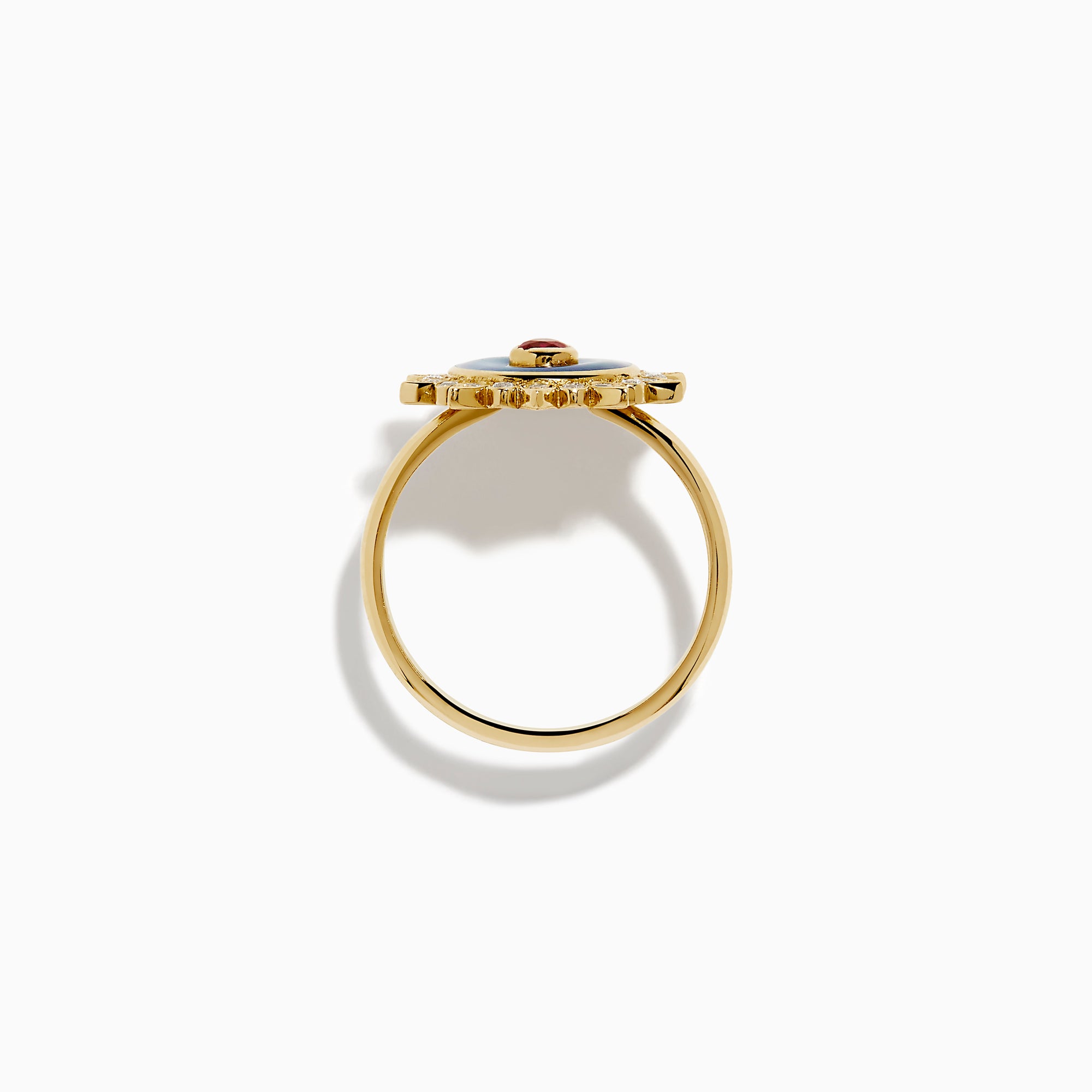 The 14K Yellow Gold Ruby, Diamond, and Enamel Ring showcases a central teardrop ruby, a blue enamel circle, and an outer border of round diamonds in a sunburst design.