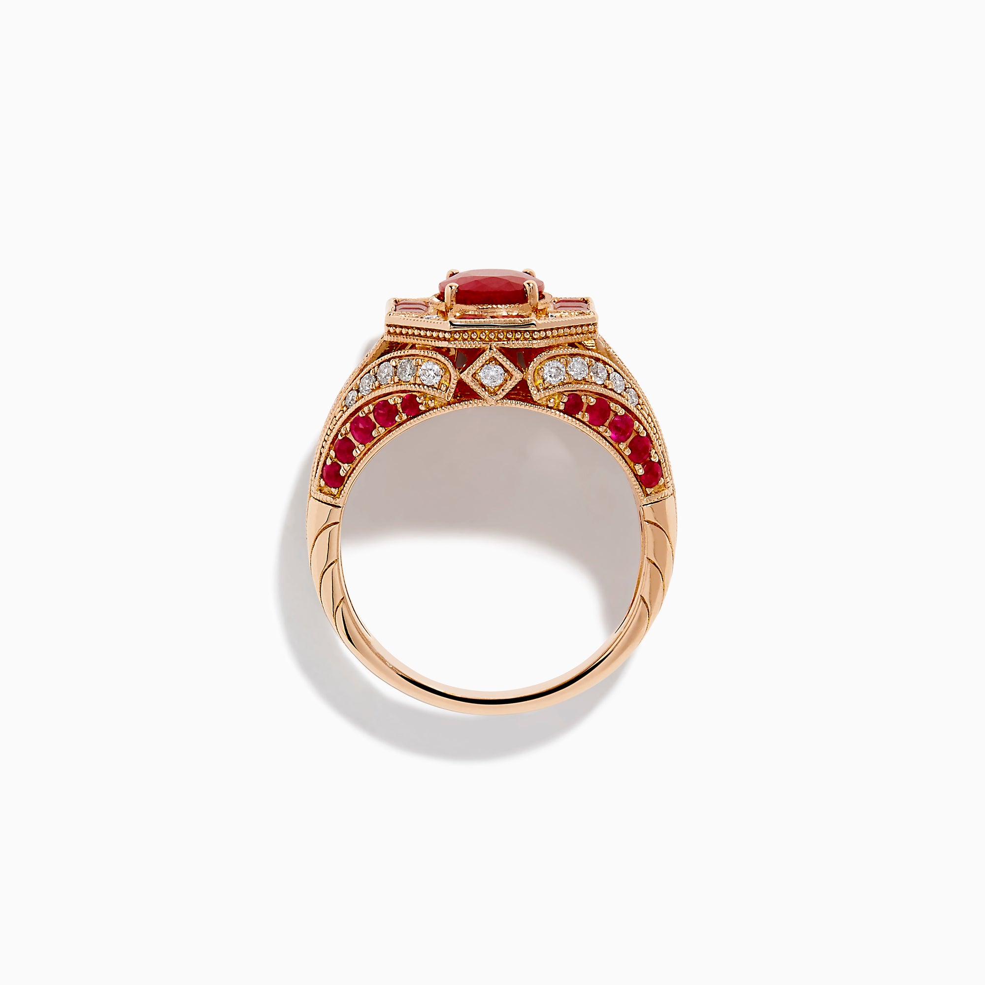 The 14K Rose Gold Ruby and Diamond Art Deco Ring features an oval ruby center, surrounded by square and rectangular rubies and small white diamonds in a geometric, ornate rose gold setting.