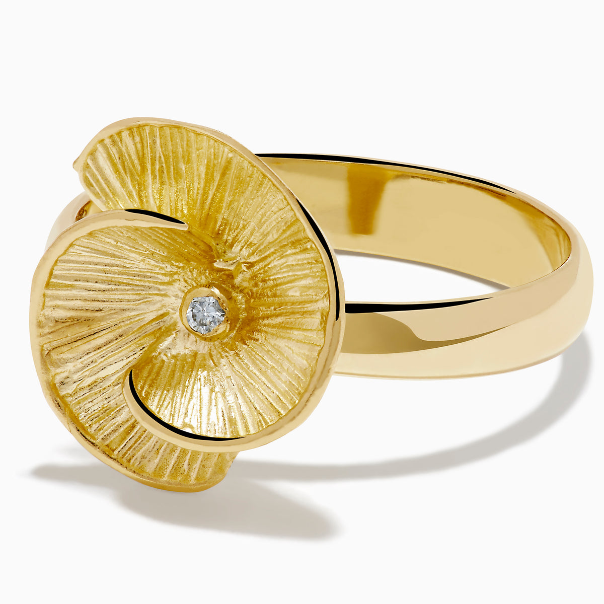 The 14K Yellow Gold Diamond Flower Ring showcases a textured, flower-shaped design in yellow gold with a central diamond, set against a plain white background.