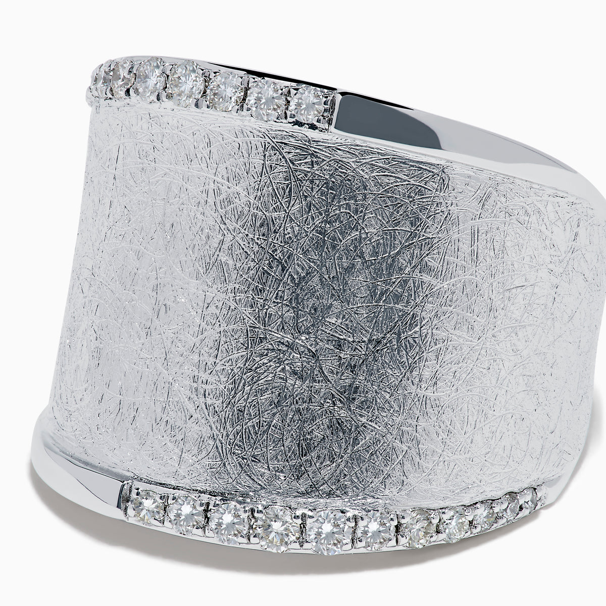 The 925 Sterling Silver Diamond Accented Wide Ring showcases a matte, textured band bordered by curved rows of sparkling diamond accents along its top and bottom edges.