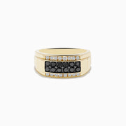 The Mens 14K Yellow Gold White and Black Diamond Ring features a rectangular center, two rows of black diamonds bordered by white diamonds, all set in polished yellow gold against a plain white background.