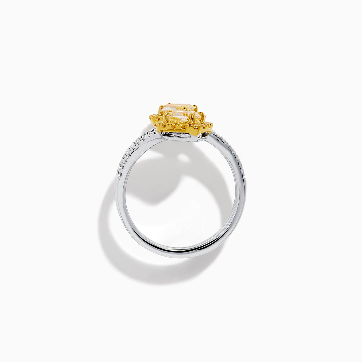 The 18K Two-Tone Gold Yellow and White Diamond Wrap Bypass Ring features two rectangular yellow stones bordered by smaller yellow gems on a spiral band, accented with sparkling white diamonds.